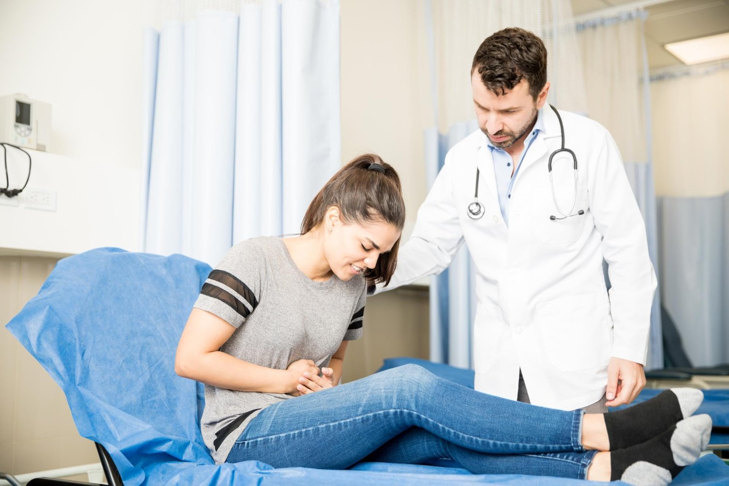 Hepatology in San Diego specialist examining patient